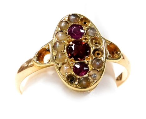 A Victorian garnet amethyst and seed pearl ring, in an oval cushion setting, in yellow metal, engraved to the shank internall