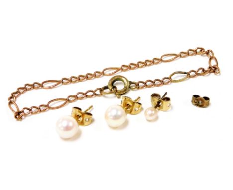 A pair of 9ct gold and cultured pearl ear studs, further ear stud, and a gold bracelet. 
