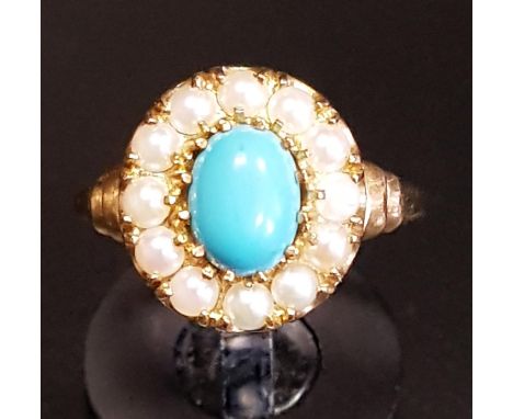 TURQUOISE AND SEED PEARL CLUSTER RINGthe central oval cabochon turquoise stone in twelve pearl surround, on nine carat gold s