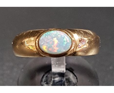 OPAL SINGLE STONE DRESS RINGthe bezel set opal on nine carat gold shank, ring size L-M 