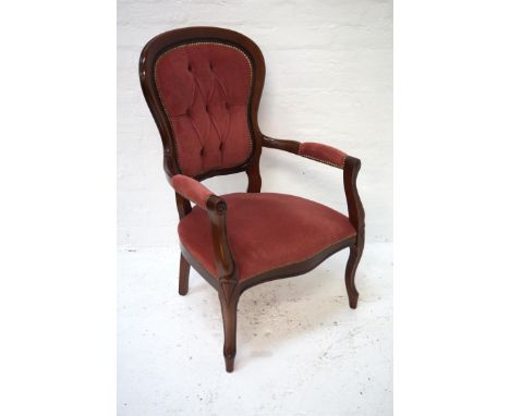 VICTORIAN STYLE MAHOGANY ARMCHAIRthe shaped button back with decorative stud detail and shaped padded arms above a stuffover 