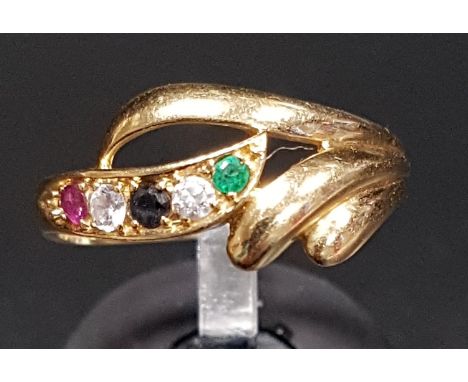 ATTRACTIVE SAPPHIRE, EMERALD, RUBY AND CZ DRESS RINGthe multi gemstones in decorative scroll setting, on fourteen carat gold 