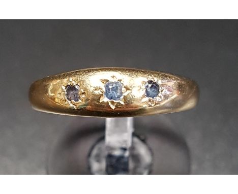 SAPPHIRE THREE STONE GYPSY STYLE RINGin nine carat gold, ring size P, approximately 2.6 grams 