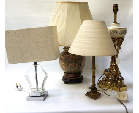 SELECTION OF TABLE LAMPSincluding a gilt brass lamp with a porcelain reservoir, 53.5cm high; a brass lamp with shade, 41cm hi