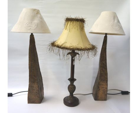 PAIR OF TAPERING STEEL TABLE LAMPSwith hammered decoration and irregular form with shades, 65cm high; together with an antiqu