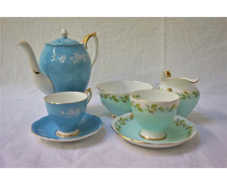 ROYAL STANDARD COFFEE SERVICEdecorated with a light blue ground with white flower heads and gilt highlights, comprising a cof