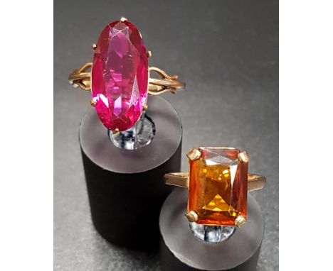 TWO NINE CARAT GOLD DRESS RINGSone with radiant cut orange gemstone and the other with oval red faceted glass, ring size J-K 