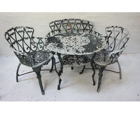 SET OF ALUMINIUM GARDEN FURNITUREcomprising a two seat bench, two armchairs and a table, all with scroll decoration (4) 