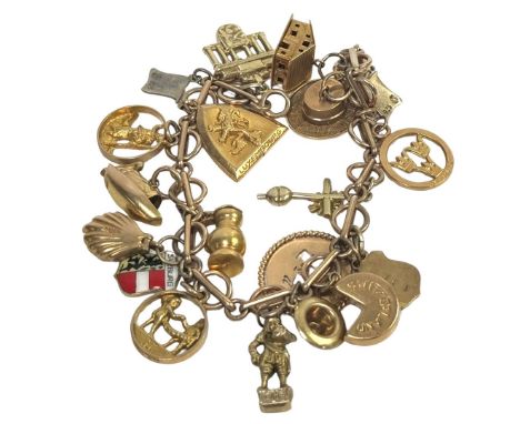 A 9ct gold charm bracelet with collection of charms, most marked, including 9ct, 14ct and 18ct, also one marked silver, 46 g 