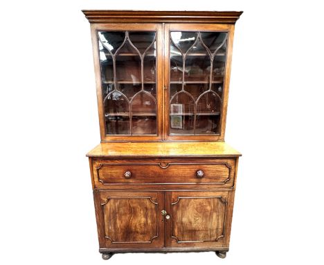 A large Victorian mahogany bureau bookcase with map or plan slides to cabinet space on bun feet, 209 x 122 x 67 cm.&nbsp;