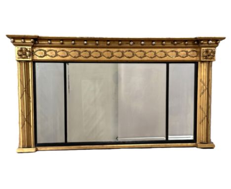 A late Regency style parcel gilt overmantel mirror,  with three plates, the moulded cornice with applied gilt balls with scro
