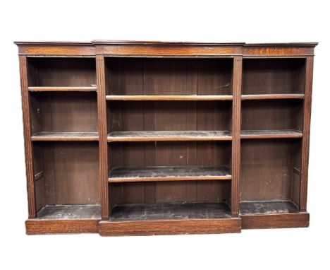 An oak breakfront open bookcase on plinth base, 125 x 183 x 33.&nbsp;