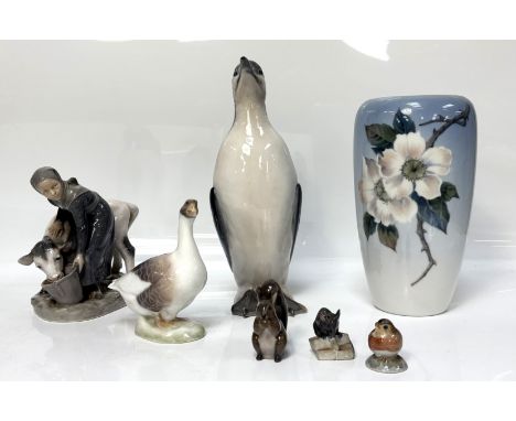 Seven assorted Royal Copenhagen porcelain figures, including a Guillemot,   numbered 468, 28cm high; a Milk maid, #779, a vas