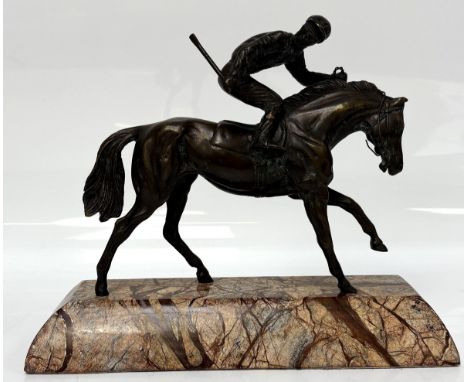 The Outsider, a modern bronzed equestrian racing figure, on resin base, with Morgan Hill label, 22cm high. 27cm long