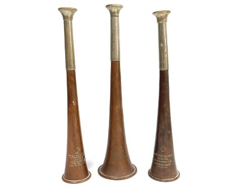 A group of three copper and white metal hunting horns, all marked Kohler and Son, two also marked Swaine and Adeney, 24cm, (3