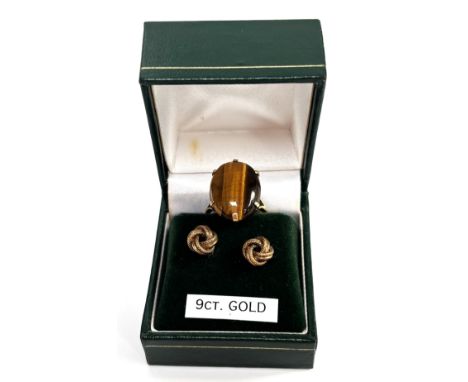 A 9ct gold cocktail ring with tiger's eye cabochon, size O, and a pair of 9ct rope knot stud earrings, 6.1 g gross.&nbsp;