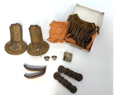 A British Royal Navy pair of gilt braid Officers Epaulettes; together with assorted military dress uniform mounts,   includin