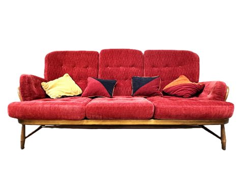 An Ercol four piece living room suite, including a ‘Windsor Jubilee’ 766 pattern settee, two matching 766  armchairs and a fo
