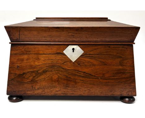 An early Victorian Rosewood Tea Caddy, circa 1840,  of sarcophagus form, with two lidded tea cannisters and a glass bowl, 22c