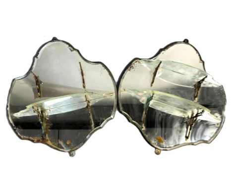 A pair of Gentleman’s bathroom mirrors, by Howard & Sons, circa 1900,   each with a cartouche shaped mirrored back and two sh