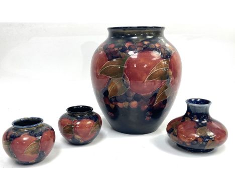 Four William Moorcroft Pomegranate vases, including ovoid vase,   of typical form, stamped and signed to the base, 22 cm; tog