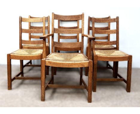 A lovely set of six Arts & Crafts oak and rush ladder-back dining chairs, the design attributed to Sir Ambrose Heal, circa 19