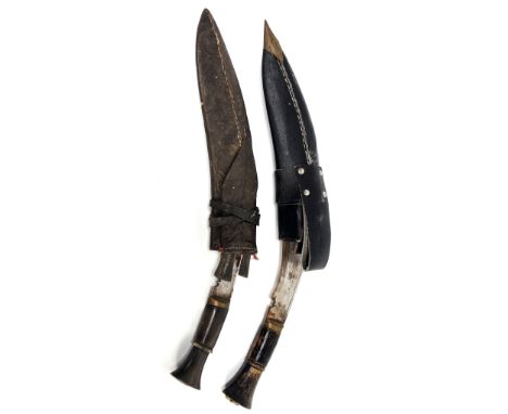 MILITARIA: A Kukuri with horn handle, and another with wood handle, both with scabbards and smaller blades, one lacking, 33 c