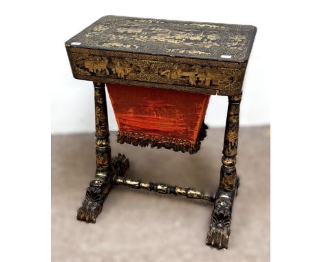 A very fine Chinese Canton black and gilt lacquered work table, circa 1855,   with a rounded rectangular hinged lid, opening 