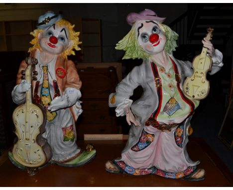 A pair of Continental ceramic clown figures of large proportions, 82cm in height (2)   