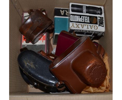 A box of assorted camera equipment including Zenit Camera, Zeiss Ikon accessories etc 
