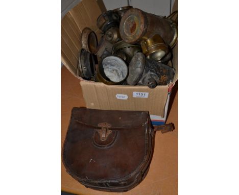 A box of various carbide lamps and a kine camera 