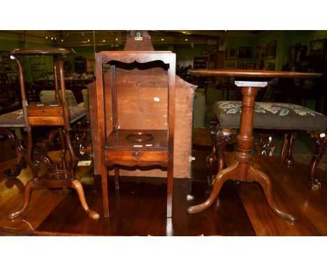 A mahogany tripod table with dish top; a square mahogany washstand and a kettle stand (3)