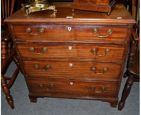 A small George III mahogany four height chest of drawers on bracket feet