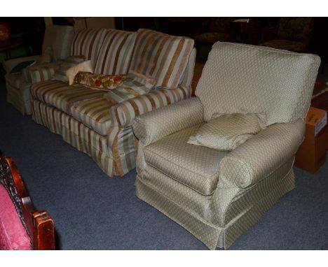 A pair of modern upholstered armchairs and a sofa 