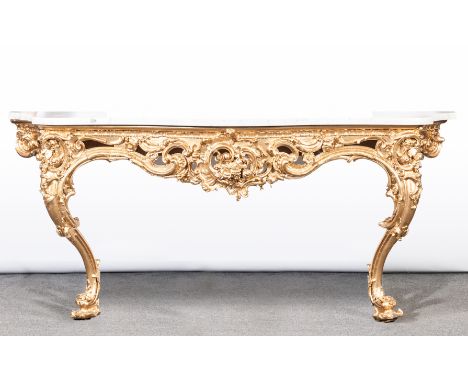 Carved wood and gilt gesso console table, 19th Century, serpentine variegated marble top, scrolled frieze decorated with flow