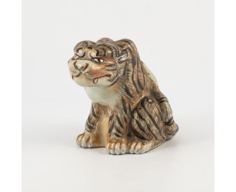 Japanese porcelain model of a sitting Tiger, probably Meiji, naturalistic colouring, 13cm.
