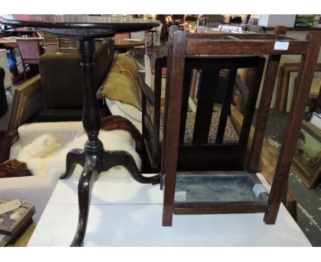 An early 19th century tripod table, the circular top above a baluster support on cabriole legs ending in pad feet, D. 76cm; t