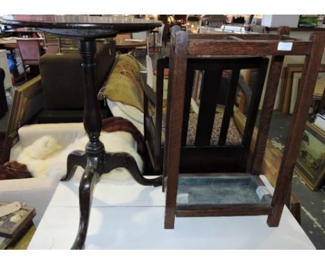 An early 19th century tripod table, the circular top above a baluster support on cabriole legs ending in pad feet, D. 76cm; t