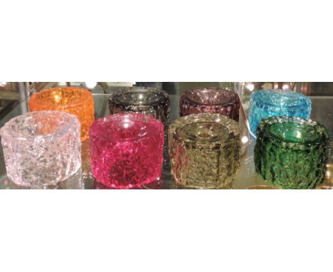  A set of 8 Whitefriars bark candlesticks in different colours of ruby, amethyst, willow, kingfisher blue and others.
