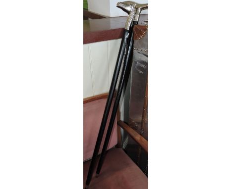 Ebonised walking stick with chrome handles in the form of a horse's head, together with another walking stick