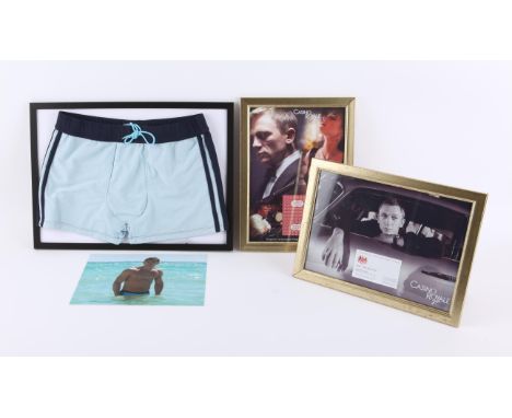 James Bond - Replica props including Casino Royale Vesper Lynd business card, Daniel Craig Trunks from Casino Royale, and a C