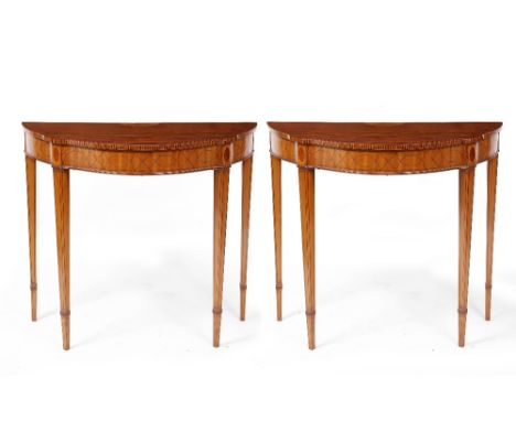 A PAIR OF SATINWOOD CONSOLE TABLES with inlaid decoration and square tapering legs, each 84cm wide x 41cm deep