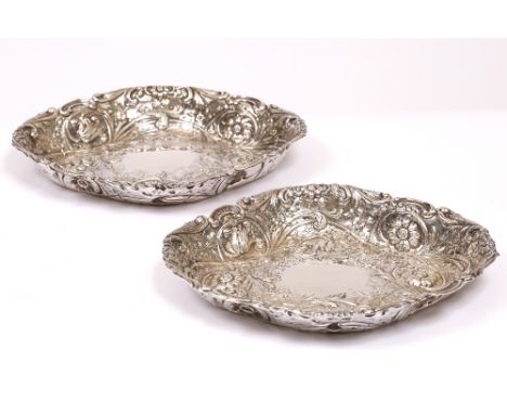 TWO GEORGIAN AND LATER OVAL SILVER SERVING DISHES with chased and engraved foliate decoration and marks for 1799 and makers m