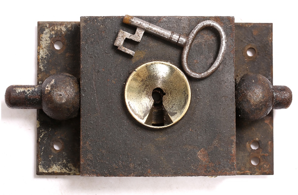A 19TH CENTURY IRON AND BRASS HEAVY DOOR LOCK possibly from a jail cell