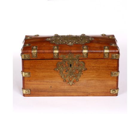 A VICTORIAN WALNUT TEA CADDY of rectangular form with engraved strapwork decoration and with twin lidded compartments within,