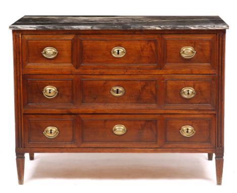 AN EARLY 19TH CENTURY FRENCH COMMODE with marble top over three short and two long drawers, with fluted corners and standing 