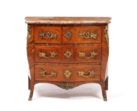 A LOUIS XV MARBLE TOPPED SERPENTINE COMMODE with two short over two long drawers, the commode applied with ormolu mounts and 