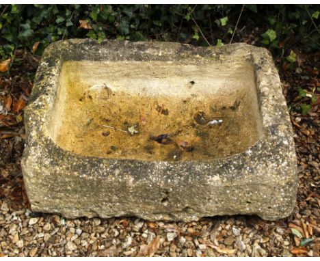 AN OLD LIMESTONE TROUGH of rectangular form, 70cm long x 49cm wide x approximately 32cm high (AF)