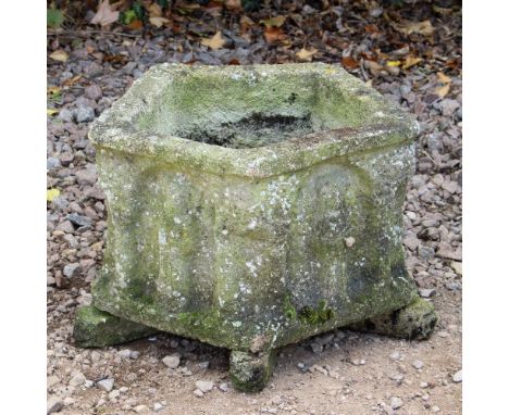 A RECONSTITUTED STONE PENTAGONAL PLANTER decorated in relief with classical figures, 44cm wide x 30cm high