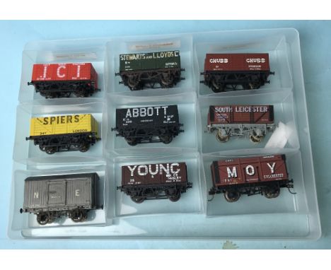 Nine assorted Hornby Lima and Bachmann plank wagons